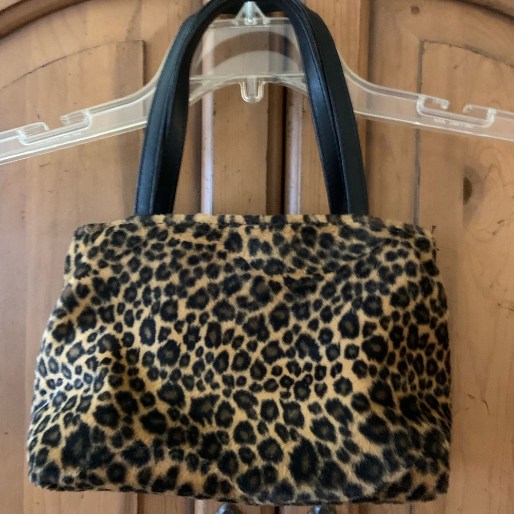 Plush leopard print purse.